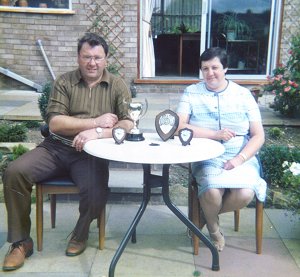 Ron, in later years, with his wife Sylvia, and their gardening trophies