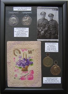 collection of medals and cards