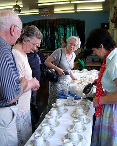 Megan Fitzgerald-Plummer is pouring tea and with her are the sisters, Mary King and Sheila Skitt. 