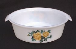 Casserole with spray of yellow roses