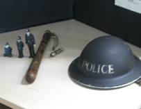  Wartime tin hat and Truncheon