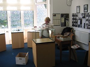 Kath Kiely sorting out the display cases.